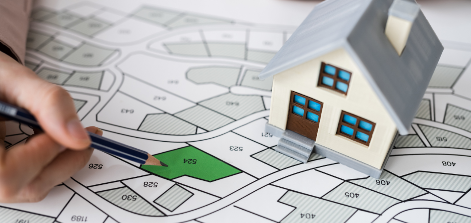 a person with a map of a community house and a pencil