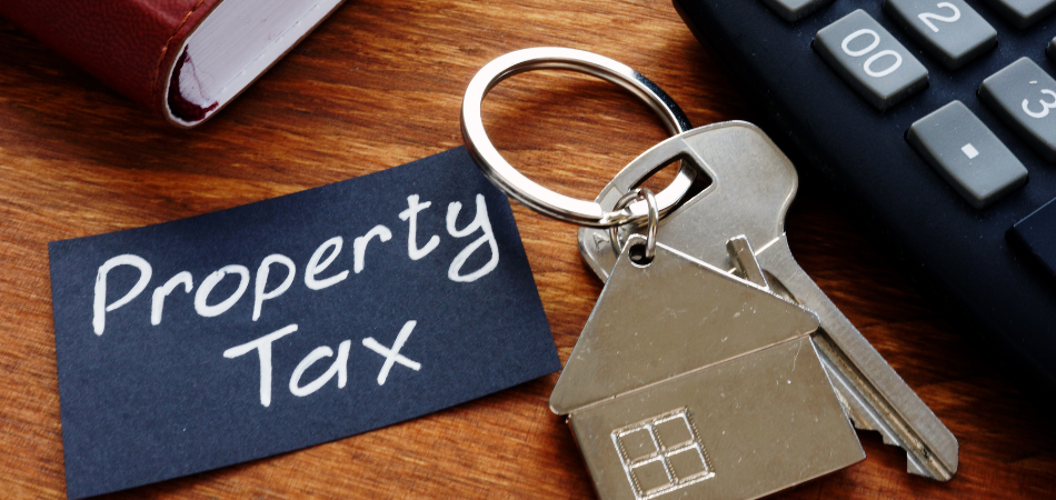 A house key next to a calculator