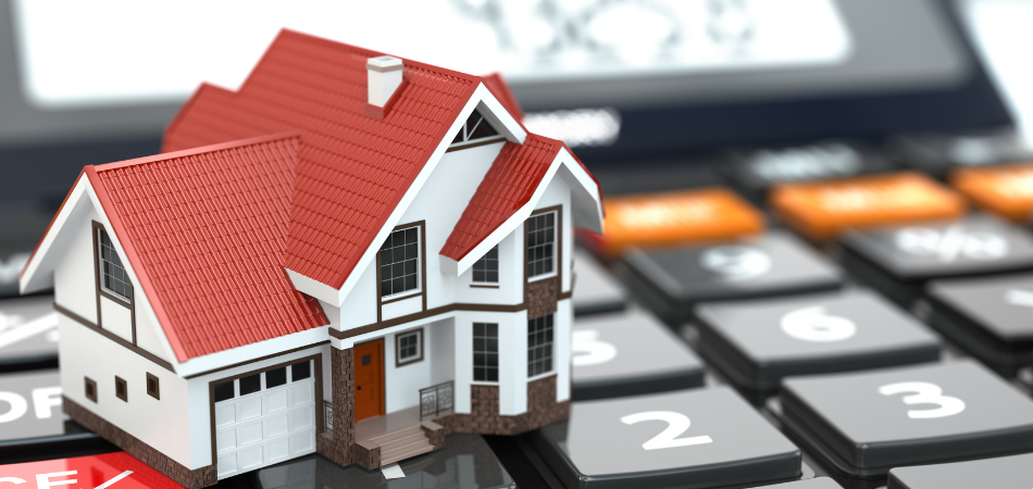 A model home on top of a calculator