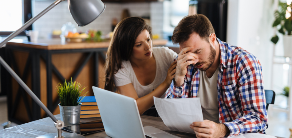 A wife is comforting her stressed out husband
